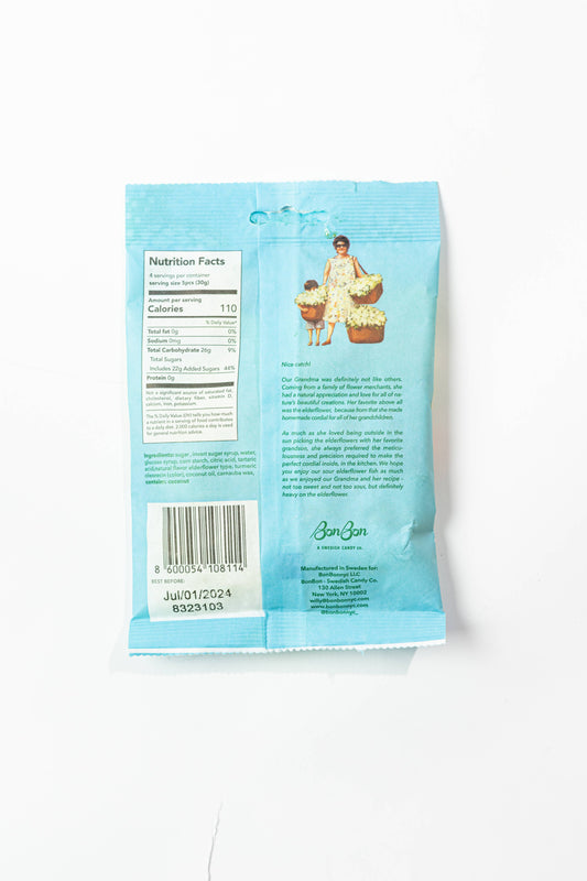 Back of a blue package with nutritional information and branding on a white background