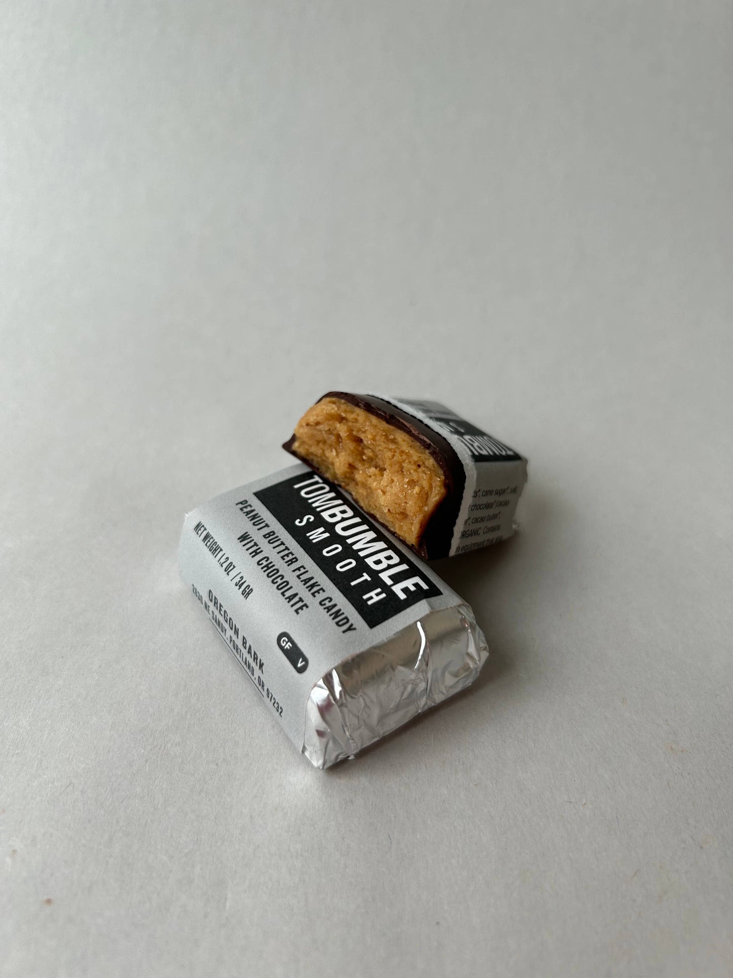 Unwrapped Tom Bumble Nutty and Smooth candy bars with chocolate coating